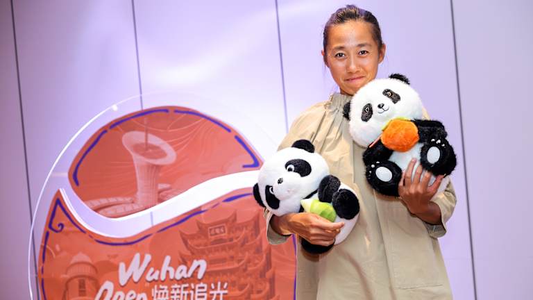 Zhang Shuai with a few more pandas at the player party.